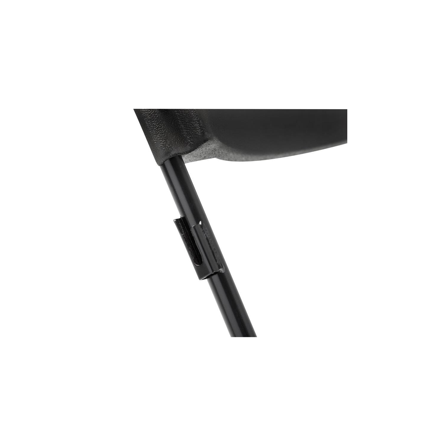 Close-up of plastic folding chair hinge and locking mechanism